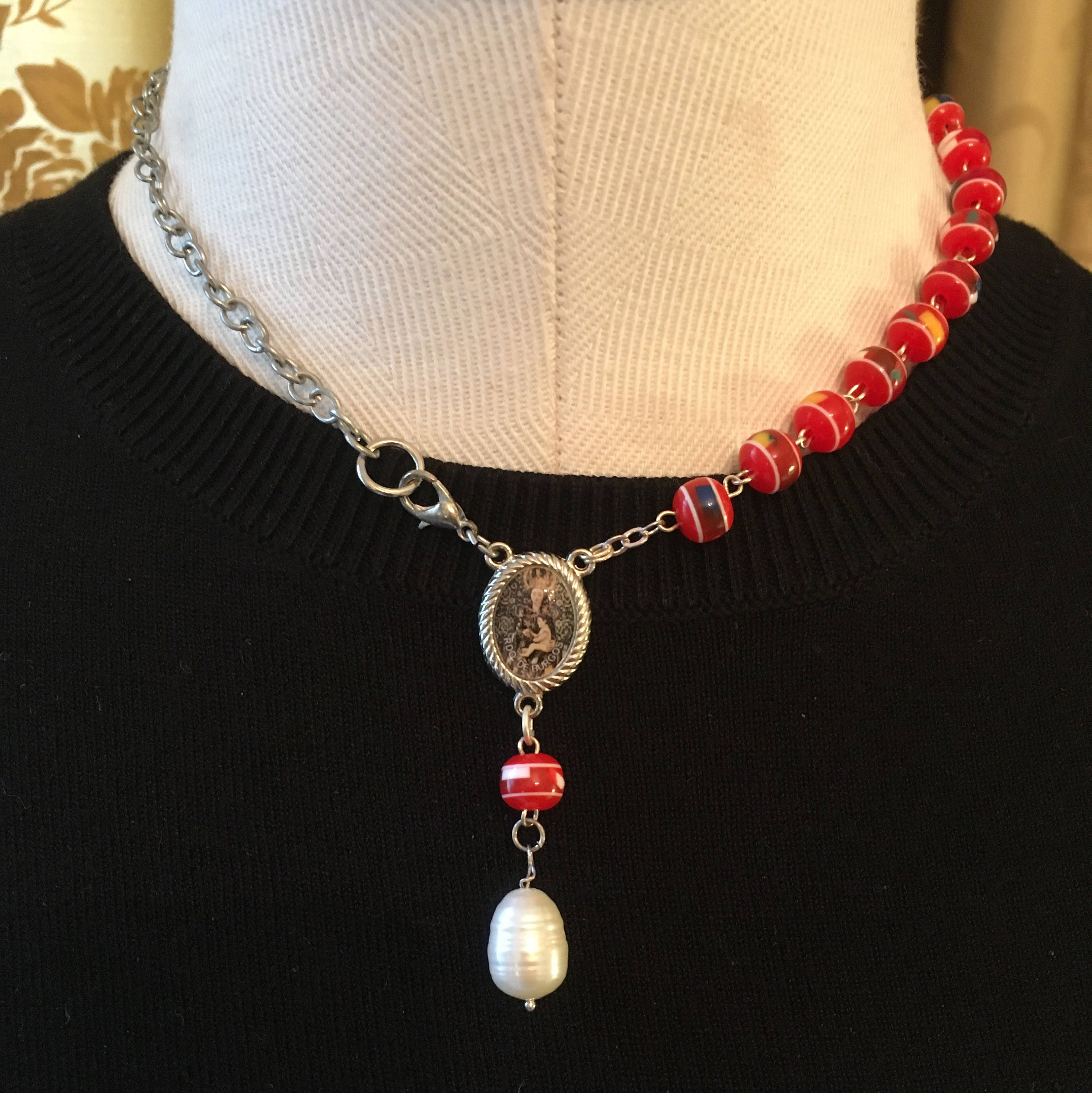 Beaded necklace with religious medal and pearl