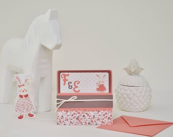 Wedding invitation with charming little bunnies and flowers patterns