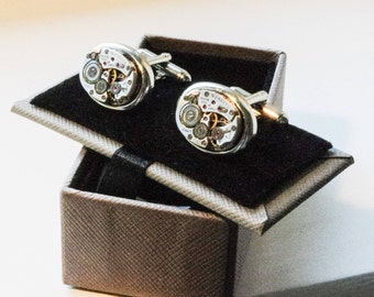 Elgin watch movement cufflink's in display box.