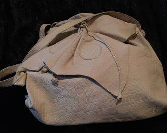 Carlo Fiori cream color, all occasion handbag.