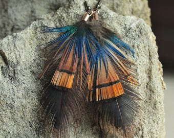 Overlaid 2 pheasant feathers and a Peacock earrings