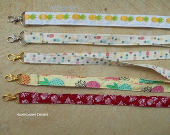 Pineapple lanyards plus charms. Five trendy style pineapple lanyards for keys and badges.