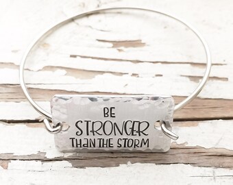 Hand stamped Be Stronger Than The Storm bangle bracelet inspirational jewelry affirmation jewelry