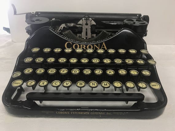 Corona four portable typewriter working with case