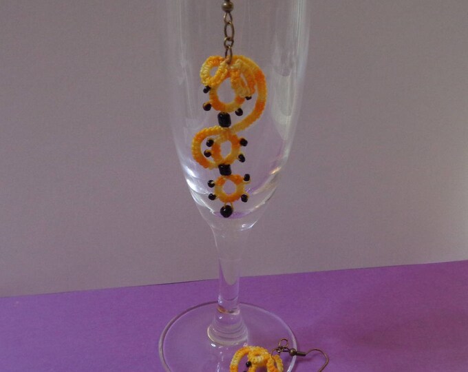 Earrings tatting variation of yellow and charcoal beads