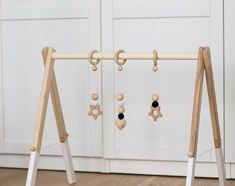 Wooden baby gym, no hangers, only frame + three wooden rings