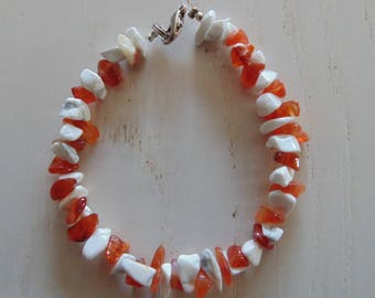 a bracelet made of two kinds of stones gems.