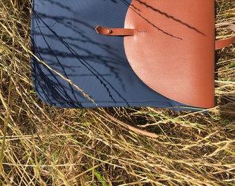 Small water-resistant canvas bag with leather details