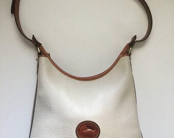Vintage Dooney and Bourke beige and tan cross body purse