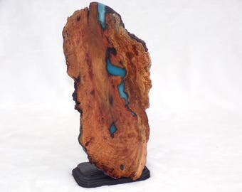 blue glow in the dark wooden sculpture