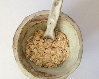 white ceramic bowl and spoon