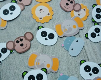 animal theme table confetti in the jungle