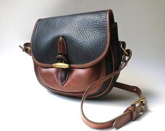 Dooney and Bourke vintage Distressed AWL Black and British Tan Leather Outback Crossbody Bag / Saddle Bag / Hipster Preppy Equestrian