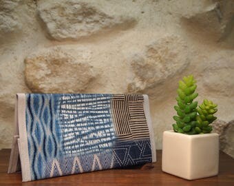 Checkbook cover and blue pen in oilcloth
