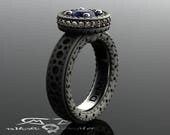 Brogue style blue sapphire and whiskey diamond engagement ring. Halo wedding ring in stitched leather look. Brogue jewelry. DeMer bridal.