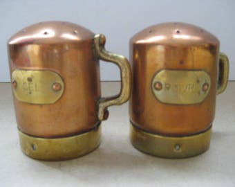 Vintage French pepper and salt shaker in copper and brass.