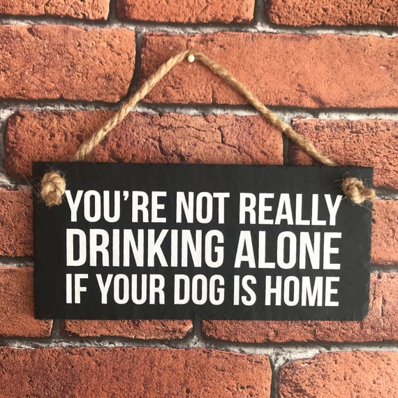 You're not drinking alone if your dog is home. Funny dog