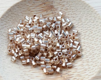 100 beads 2 mm + Czech seed beads