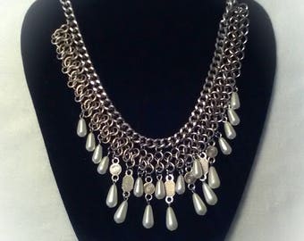 This one of a kind necklace has silver and faox pearls