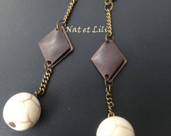 White magnesite on bronze diamond pendant