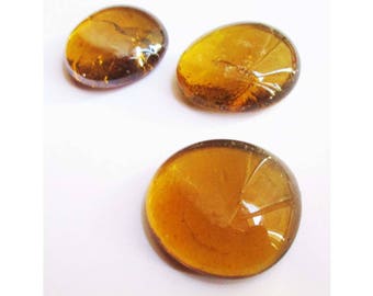3 large pebbles of glass amber cognac hues