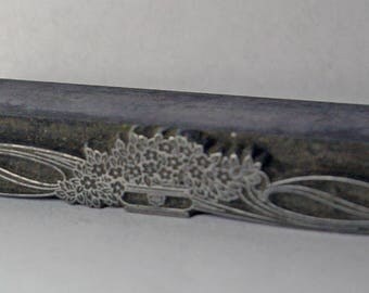 Vintage letterpress printing block, bouquet and swirls