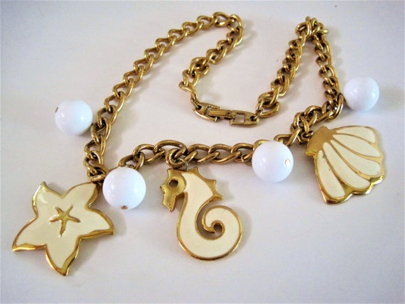 Napier Sea Charm Necklace - White Enamel on Gold Tone - Signed Script Pat. Pend - 60's Napier