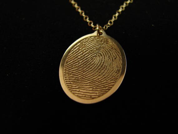 Solid 14k gold fingerprint necklace.