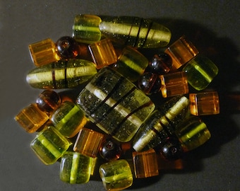 26 orange, amber, green of various shapes Indian glass beads