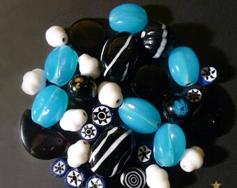 32 glass Indian blue, black, white with various shapes beads